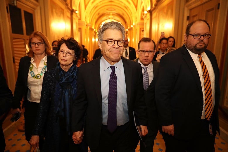 WASHINGTON, DC - DECEMBER 07: Sen. Al Franken (D-MN) (C) and his wife Franni Bryson (L) arrive at the U.S. Capitol Building December 7, 2017 in Washington, DC. Franken announced that he will be resigning in the coming weeks after being accused by several women of sexual harrassment. (Photo by Chip Somodevilla/Getty Images)